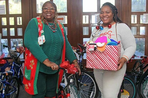 Employees from across MUSC's multiple campuses, including the Parkshore Office, participated in Angel Tree program. Here, Parkshore's Sharon Dupree-Capers, left, and Monique Hazel help gather gifts for delivery. Photo by Cindy Abole