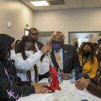 Congressman James Clyburn looks on as students from Bowie State Entrepreneurial Academy show off a small machine they created as part of the Entrepreneurship Living Learning Center. (Photo by Ryan Pelham)